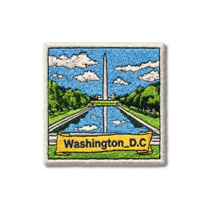 May include: A square embroidered patch featuring a scene of the Washington Monument centered above a reflecting pool, surrounded by green trees and a blue sky with white clouds. A yellow banner at the bottom displays the text Washington_D.C.