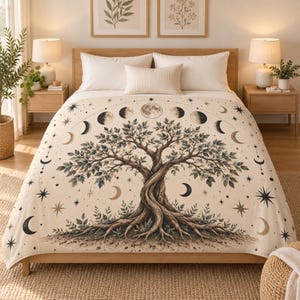 May include: A cream-colored bedspread featuring a large, central tree with exposed roots. The design includes a lunar cycle arc across the top, surrounded by various star and crescent moon motifs in shades of brown, black, and muted gold.
