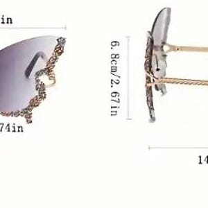 May include: Butterfly-shaped sunglasses with a gradient lens. The frame is gold-colored with decorative embellishments on the outer edges. The sunglasses measure 5.94 inches wide, 2.95 inches high, and 5.78 inches long.