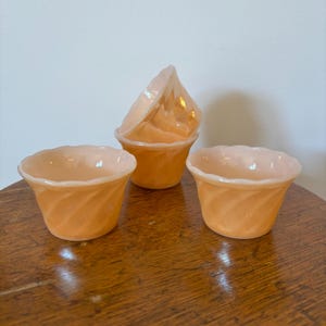 Super Shiny Vintage Anchor Hocking Fire~King Peach Lustreware Swirl Custard Cups. Set of 4. Measures 3.25” x 2.25”. No Chips/Cracks.