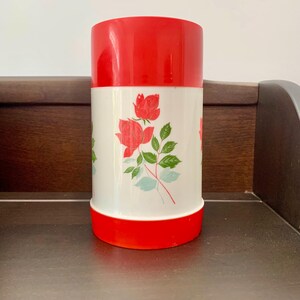 Vintage Aladdin Floral Thermos. No Visible Chips or Cracks in the Container, Some Wear in the Pattern on One Side. Beautiful Colors