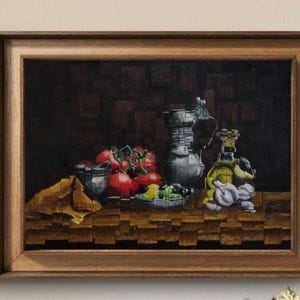 May include: A framed still life painting featuring a collection of ripe red tomatoes, a silver pitcher, and a bottle of olive oil. The painting also includes a plate of green vegetables and a yellow cloth. The background is dark.