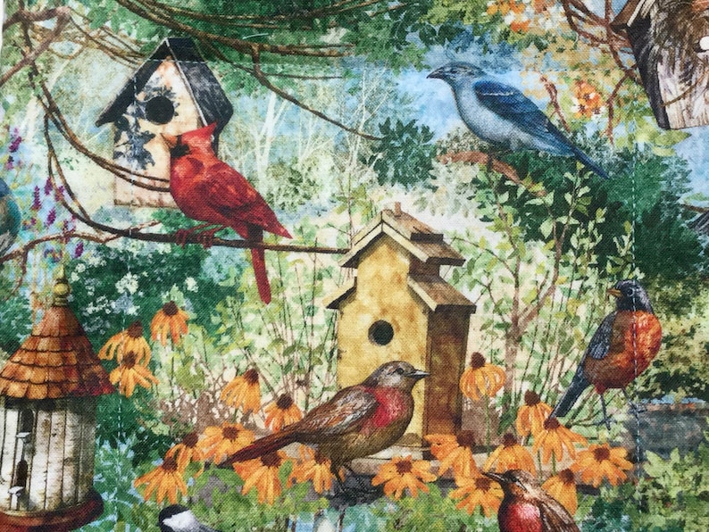 May include: A colorful illustration of a birdhouse scene with a bluebird, a cardinal, a robin, and a brown bird. The birdhouses are painted in shades of brown and yellow. The background is a lush green forest with yellow flowers.