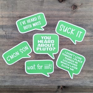 May include: A collection of six green speech bubble stickers with white borders and various phrases in white text. The phrases include "I'VE HEARD IT BOTH WAYS," "SUCK IT," "C'MON SON," "YOU HEARD ABOUT PLUTO?," "wait for iiiiiit!," and "I DON'T LOSE THINGS..."