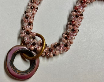Bubblegum Pink and Bronze Spiral Weave Beadwoven Necklace with Handmade Glass Copper Pendant Ring Artisan Made Necklace