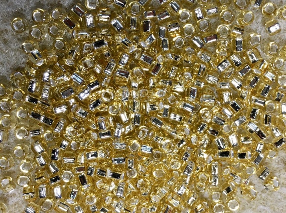 11//0 Japanese seed beads Matte Silver Lined Lt Gold-28grams
