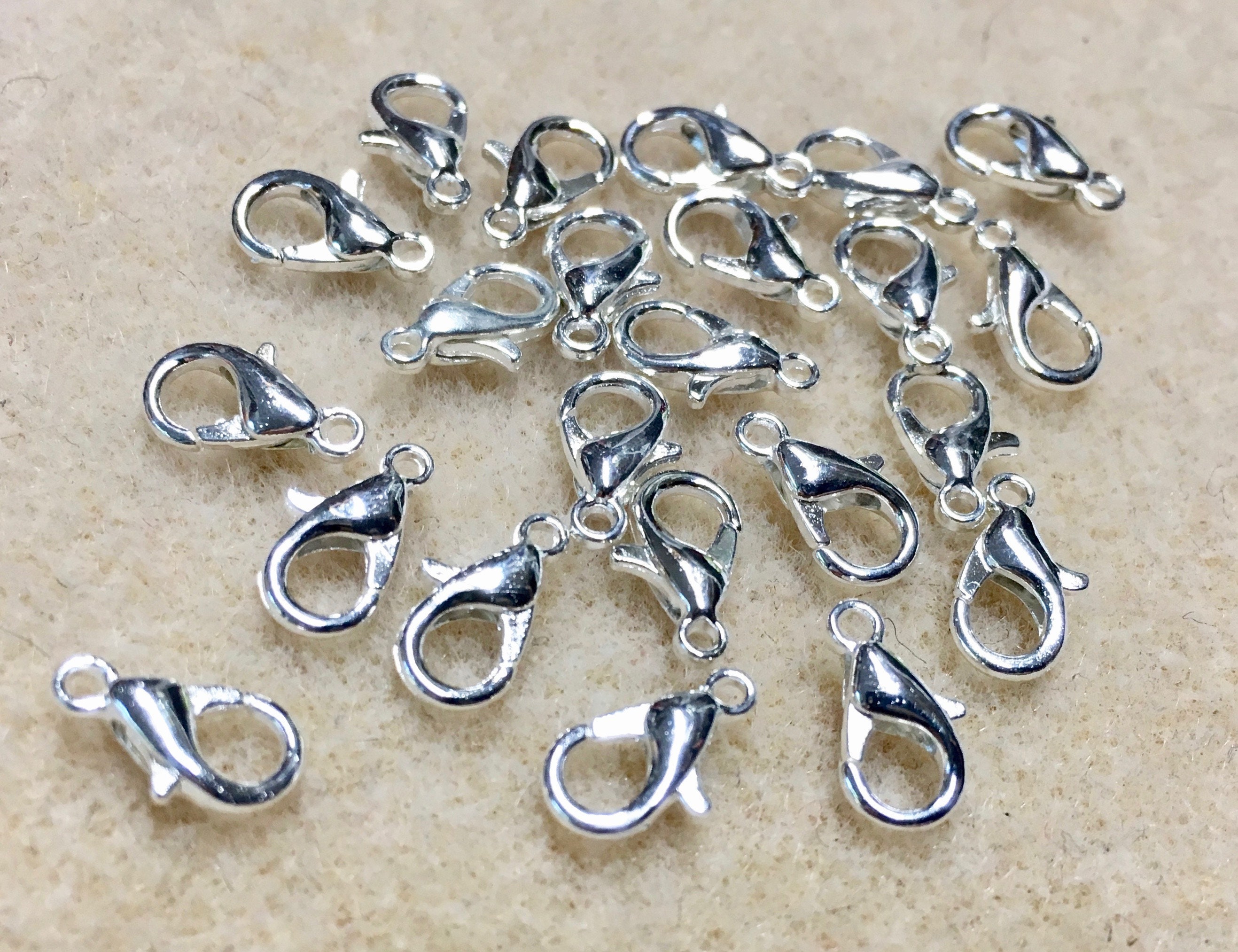 SILVER PLATED 14 x 7  LOBSTER CLASPS WITH JUMP RINGS IDEAL JEWELLERY MAKING 