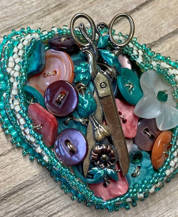 Button brooch deals