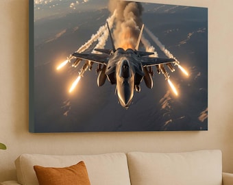 May include: A canvas print of a fighter jet in flight, viewed head-on. The jet is dark gray with multiple missiles and flares emitting bright orange flames. Smoke trails behind the aircraft against a backdrop of a dark, mountainous landscape.