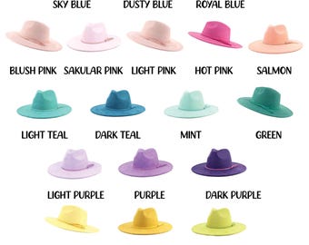 May include: An assortment of vegan suede short brim hats in a spectrum of colours, such as sky blue, dusty blue, royal blue, blush pink, and hot pink. Each hat is labelled with its colour, providing a wide selection for different tastes.