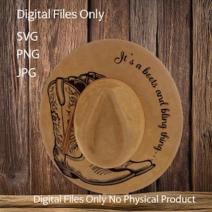 May include: A brown cowboy hat with a pair of cowboy boots printed on it. The hat has the text "It's a boots and bling thing..." printed on it.