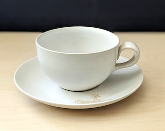 Eva Zeisel design for Monmouth flat cup and saucer. Animal design.