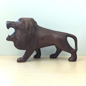 The Roar. Vintage wooden carved lion figurine.