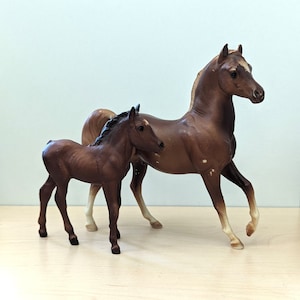 Vintage 1980s Breyer Classic Arabian stallion and Marguerite Henry's Sea Star figurines