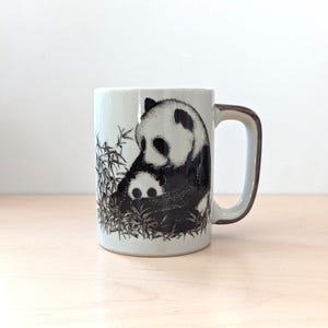 Rustic stoneware coffee mug with cute pandas.