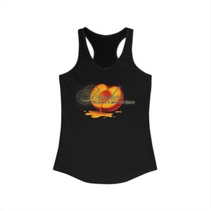 May include: Black racerback tank top featuring a graphic of a peach with the word "Peaches" in a stylized font. The text "The Heroes of Shattered Dreams" is below the peach graphic. The peach is red, orange, and yellow.