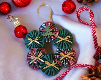 Christmas Wreath in Mixed Fabrics - a Dark Green and Red with Green and White Snowflakes. Hand Stitched Fabric Yo Yo's from HandCrafted4You