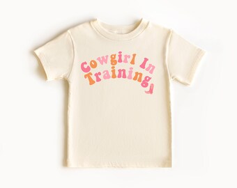 レトロカウガールベビーキッズ幼児用シャツカントリーウエスタンカウガールグラフィックTシャツトレーニング中のカウガールガール誕生日プレゼントかわいいレトロキッズウエスタンシャツ