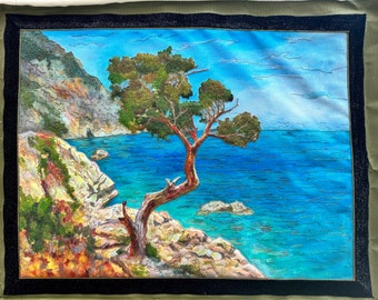 Single tree by the sea