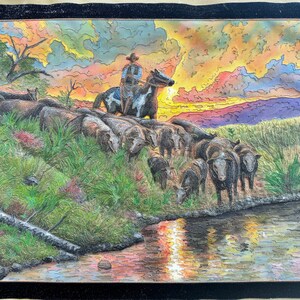 Cowherd at sunset