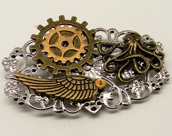 Steampunk jewelry.Steampunk octopus.  Angel wing and gears brooch.