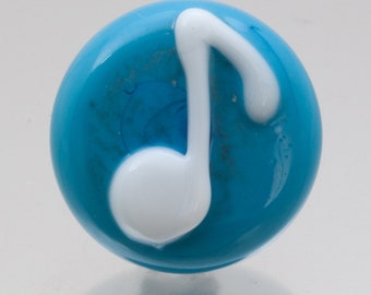 Lampwork glass by Jennie Yip At sign @ in light blue and black Lapel pin