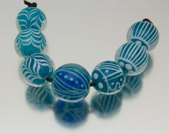 Lampwork bead set: Keep Breathing in blue-green teal and white. Lampwork by Jennie Yip