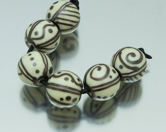Lampwork bead set: Keep Breathing in ivory and DSP. Lampwork by Jennie Yip