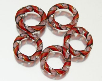 Glass ring set: Twisted red and white. Jumprings, sliders, stitch markers. Lampwork by Jennie Yip