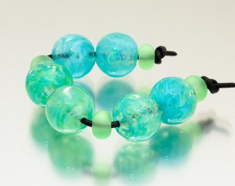 Lampwork bead set: That Spring Feeling. Lampwork by Jennie Yip