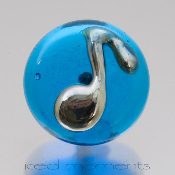 Lampwork glass by Jennie Yip At sign @ in light blue and black Lapel pin