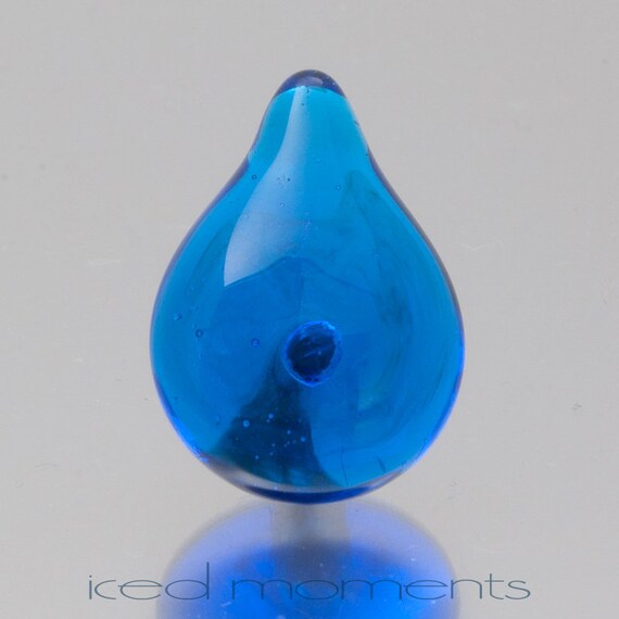 Lampwork glass by Jennie Yip At sign @ in light blue and black Lapel pin