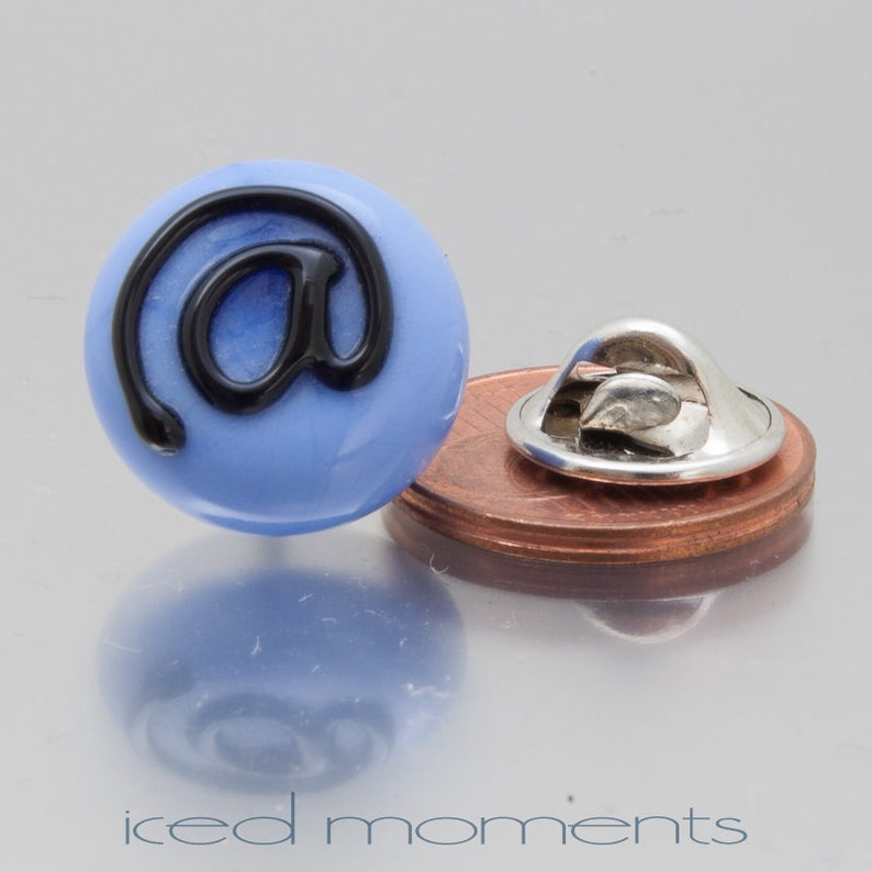 Lampwork glass by Jennie Yip At sign @ in light blue and black Lapel pin