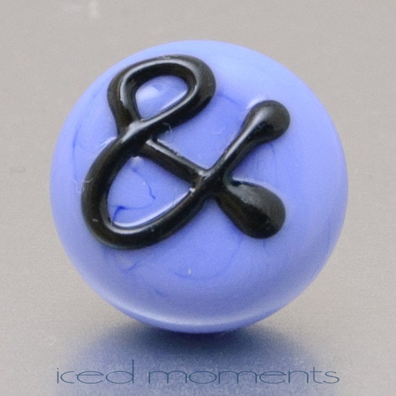Lampwork glass by Jennie Yip At sign @ in light blue and black Lapel pin