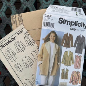 May include: A Simplicity 5306 sewing pattern envelope featuring illustrations of various jacket and vest styles, including a tan coat with a white collar. The package displays the brand name, size BB, and technical line drawings for garment construction.