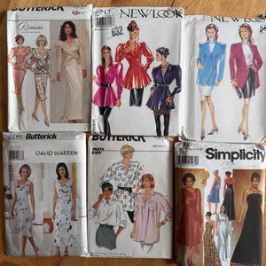 May include: Six paper sewing pattern envelopes from Butterick, New Look, and Simplicity brands. The envelopes feature illustrations of various clothing styles including blazers, skirts, dresses, and shirts, with printed brand names and model numbers.