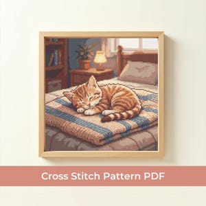 May include: A framed cross-stitch pattern depicts a sleeping orange tabby cat on a striped blanket. The artwork is set in a cozy bedroom scene with a bed, nightstand, and window. The text "Cross Stitch Pattern PDF" is at the bottom.