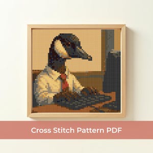 May include: A framed cross-stitch pattern showing a goose in a white shirt and red tie, at a desk. The goose has a black head and neck, with a white patch on its face. The text "Cross Stitch Pattern PDF" is at the bottom of the image.