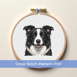 May include: A cross-stitch pattern of a Border Collie dog in a wooden embroidery hoop. The dog is black and white with a smiling expression. The text "Cross Stitch Pattern PDF" is displayed on a blue banner below the hoop.