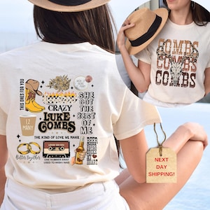 May include: A white t-shirt with a graphic design featuring Luke Combs lyrics and images. The design includes a cowboy boot, a cassette tape, a beer bottle, and rings. The text on the shirt includes "This ones for you", "1,2 Many", "She got the best of me", "Crazy Luke Combs", "The kind of love we make", "Better together", "Lovin on you", "One number away used to wish I was", "Beer never broke my heart".