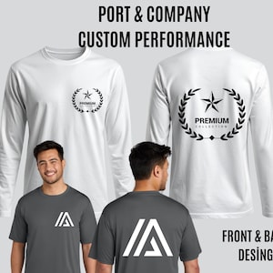 May include: White long-sleeve shirt with a black star and laurel wreath design. The text "PORT & COMPANY CUSTOM PERFORMANCE" is at the top. The text "PREMIUM COLLECTION" is inside the wreath. A gray t-shirt with a white "A" logo is also shown.
