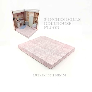 May include: A miniature dollhouse floor and a diorama of a dressing room. The floor is a rectangular box with a pink wood-grain pattern. The diorama features a desk, closet, and other furnishings. Text reads: "3-INCHES DOLLS DOLLHOUSE FLOOR".