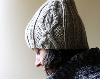 Chunky hand knit rib hat with cable and twist design.