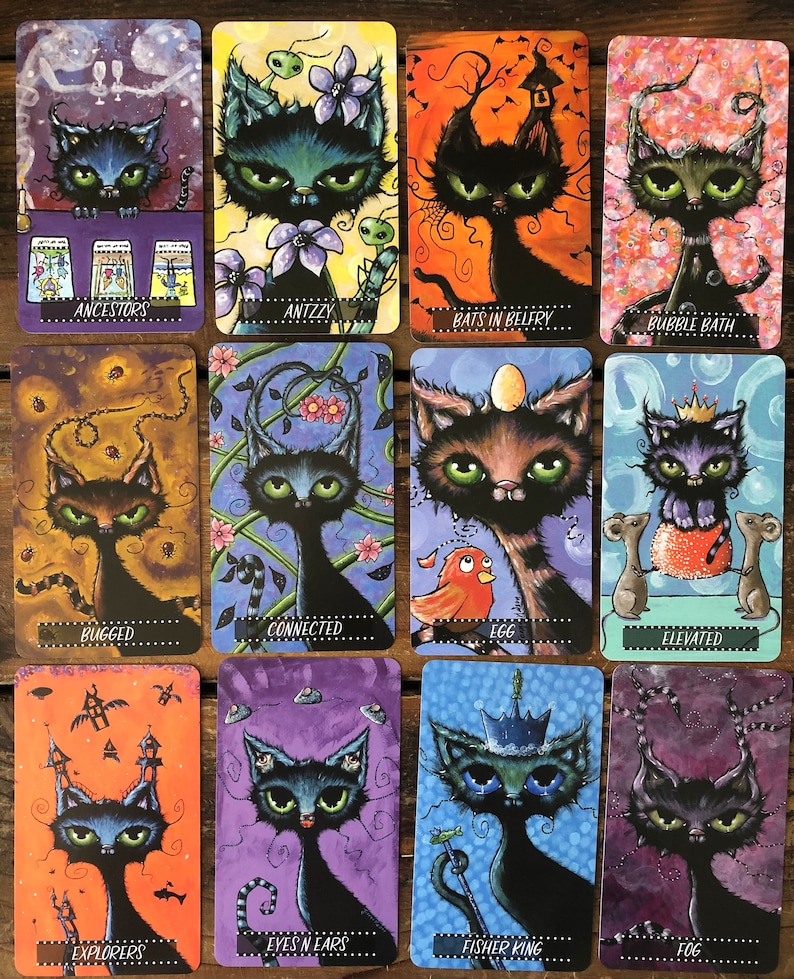 May include: A set of 12 tarot cards featuring black cats with different expressions and backgrounds. Each card has a title, such as "Ancestors", "Antzy", "Bats in Belfry", "Bubble Bath", "Bugged", "Connected", "Egg", "Elevated", "Explorers", "Eyes n Ears", "Fisher King", and "Fog".