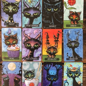 May include: A set of 12 tarot cards featuring black cats with different expressions and backgrounds. The cards are illustrated with colorful, whimsical designs and include phrases like "Phases", "Sticky Situation", "Darkness", "Growth", "Picnic", "Pink Elephants", "Possibilities", "Fallen Star", "Reflection", "Soul Food", "Imagination", and "Sprinkles".