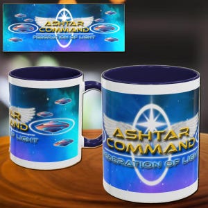May include: Two ceramic mugs with a blue interior and handle. The mugs feature the text "Ashtar Command Federation of Light" with a graphic of a star and wings, and images of flying saucers on a blue background.