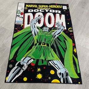 May include: A vintage comic book cover featuring Doctor Doom, a Marvel Comics supervillain. The cover is black with a green cape and a silver and black costume. The title "Doctor Doom" is in large, white letters.