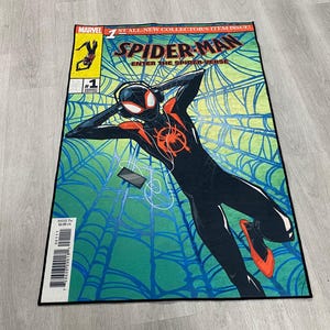 May include: A comic book cover featuring Spider-Man in a black and red suit, with the text "Spider-Man: Enter the Spider-Verse" and "Marvel" on the cover. The background is a green and blue web pattern.