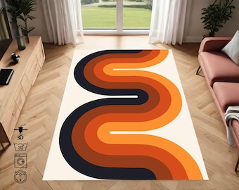 May include: A white rug with a retro design featuring a repeating pattern of orange, brown, and black curved lines. The rug has a white background and is perfect for adding a touch of vintage style to any room.