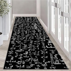 May include: Black and white runner rug with a pattern of mathematical equations and formulas. The rug has a white background with black text.